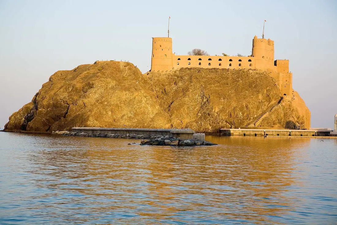 Al Jalali Fort above the harbour in Old Muscat at golden hour